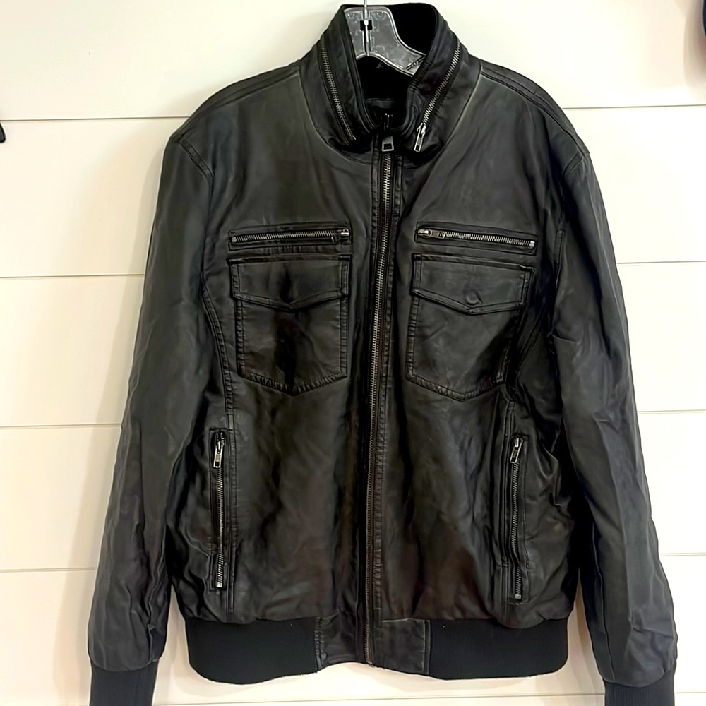 Black rivet. Worn once. Faux leather jacket. Pristine condition.